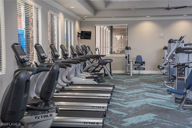 11599 Meadowrun Cir, Fort Myers, FL 33913 - workout area featuring a ceiling fan, baseboards, crown molding, a tray ceiling, and carpet floors