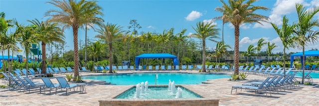 11599 Meadowrun Cir, Fort Myers, FL 33913 - community pool with a gazebo, a hot tub, and a patio area