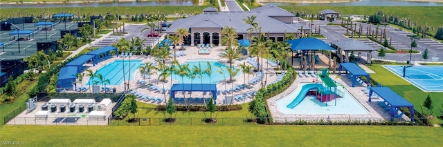 11599 Meadowrun Cir, Fort Myers, FL 33913 - drone / aerial view of a pool and a large body of water