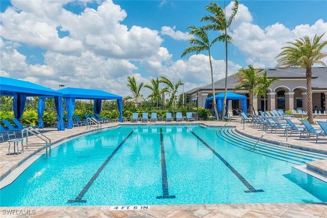 11599 Meadowrun Cir, Fort Myers, FL 33913 - community pool with a gazebo and a patio area