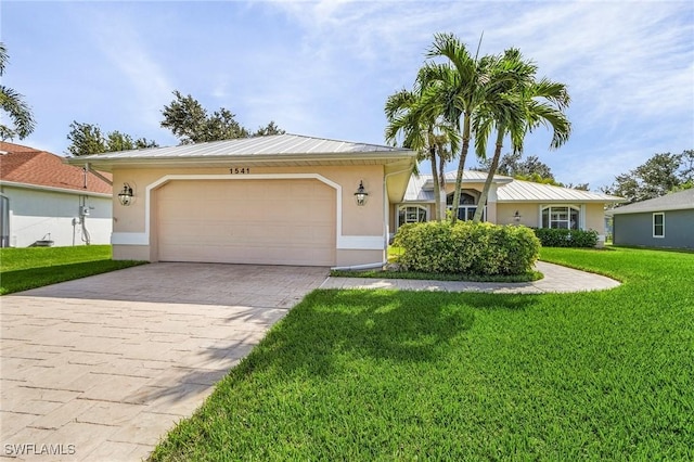 ranch-style home with a garage and a front lawn