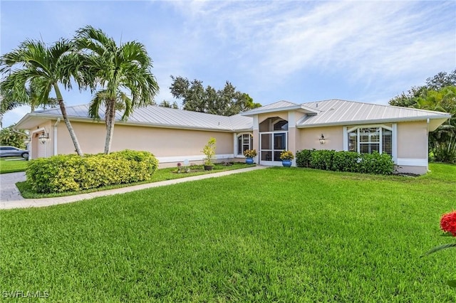 single story home with a garage and a front yard