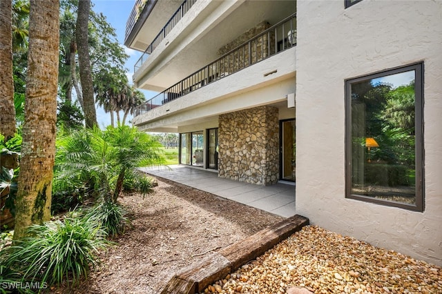 exterior space with a patio and a balcony