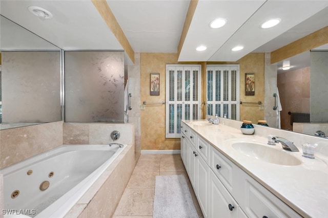 bathroom with tile patterned floors, vanity, and separate shower and tub