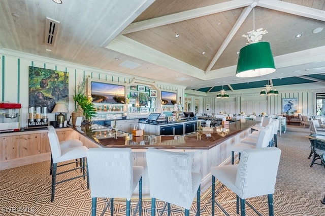 interior space with lofted ceiling, a kitchen bar, light carpet, light brown cabinets, and wooden ceiling