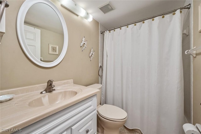 bathroom with vanity, toilet, and walk in shower