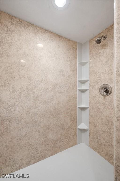 bathroom featuring built in features and walk in shower