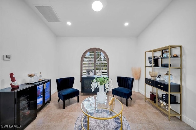 sitting room featuring baseboards, visible vents, and recessed lighting