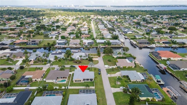 birds eye view of property with a residential view and a water view