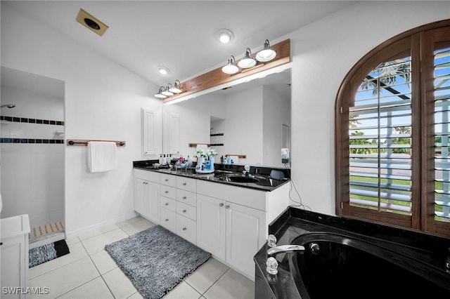 bathroom with double vanity, a bath, tile patterned flooring, walk in shower, and a sink