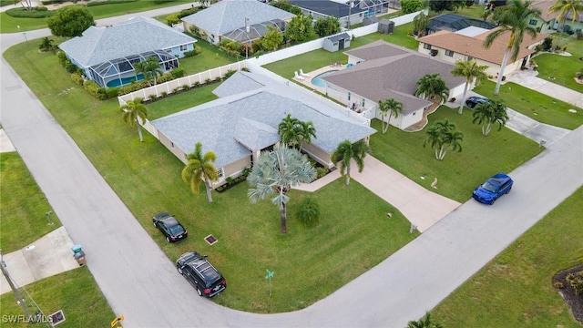 birds eye view of property with a residential view