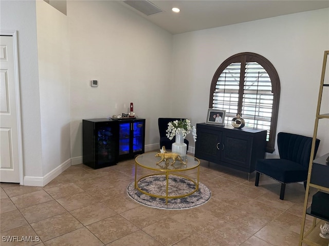 sitting room featuring visible vents, baseboards, and light tile patterned floors