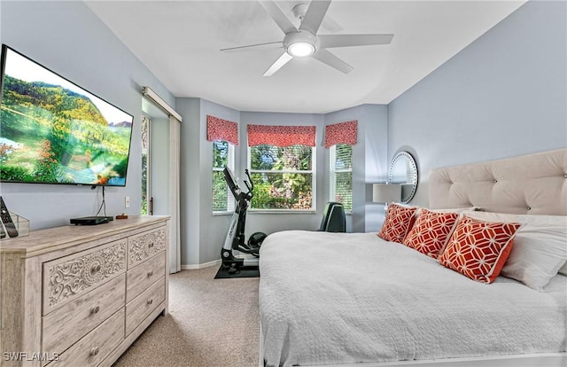 bedroom with light colored carpet and ceiling fan