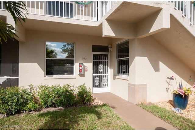 entrance to property featuring a balcony