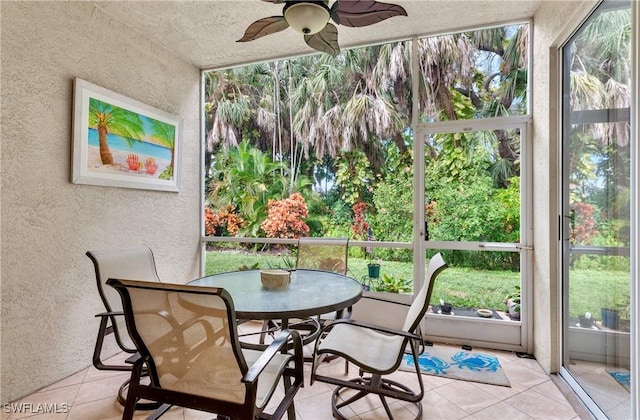 sunroom / solarium with ceiling fan and plenty of natural light