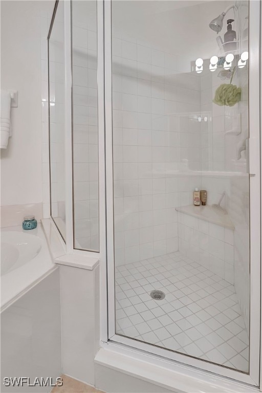 bathroom with a tile shower