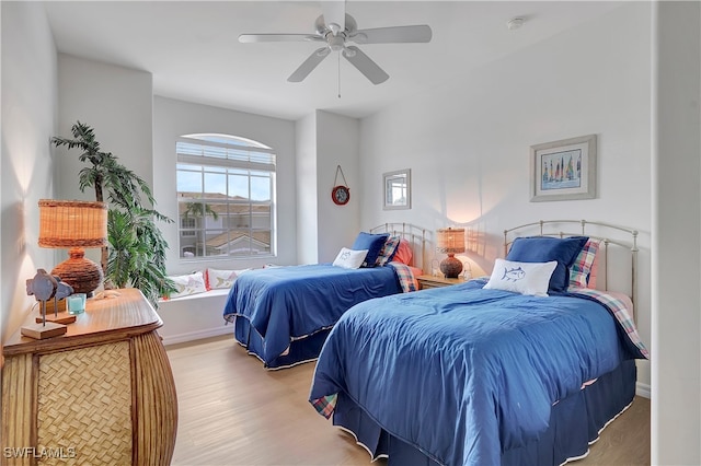 bedroom featuring light wood-type flooring and ceiling fan