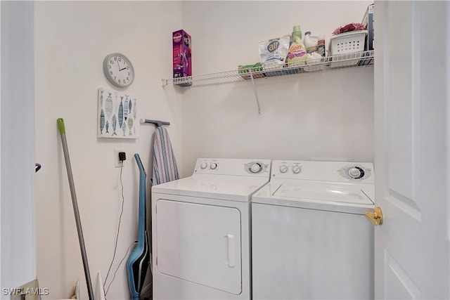 laundry room featuring washing machine and dryer