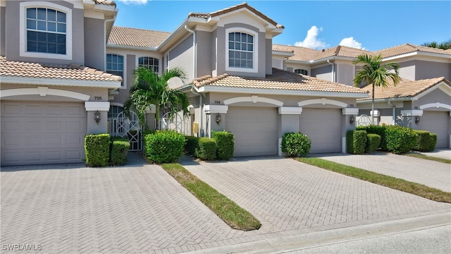 mediterranean / spanish house featuring a garage