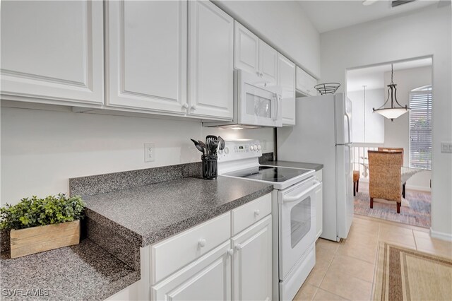 kitchen with pendant lighting, light tile patterned flooring, white cabinetry, white appliances, and ceiling fan