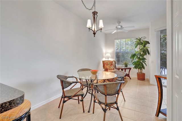 dining area with ceiling fan and light tile patterned floors