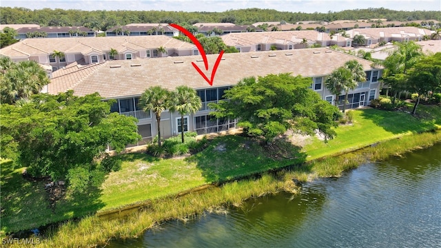 birds eye view of property featuring a water view