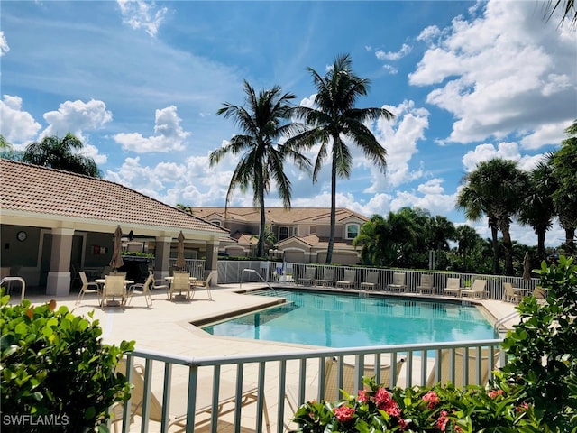 view of swimming pool featuring a patio area