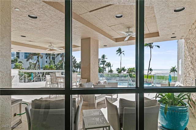 view of swimming pool featuring ceiling fan