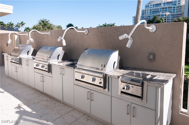 view of patio with area for grilling and exterior kitchen