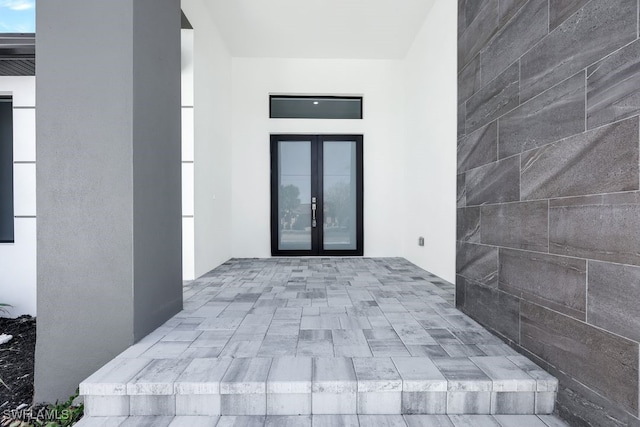 doorway to property featuring french doors