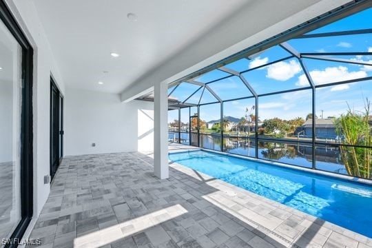 198 Gulfview Rd, Punta Gorda, FL 33950 - outdoor pool featuring a patio, a water view, and a lanai