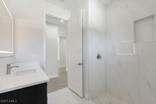 198 Gulfview Rd, Punta Gorda, FL 33950 - bathroom featuring marble finish flooring, double vanity, and a marble finish shower