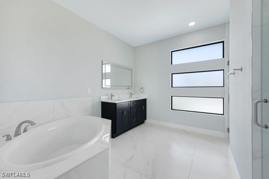 198 Gulfview Rd, Punta Gorda, FL 33950 - bathroom featuring a garden tub, double vanity, marble look tile flooring, and a shower stall