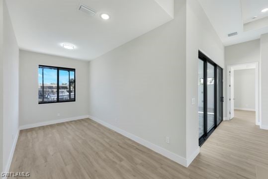 unfurnished room featuring light wood-type flooring