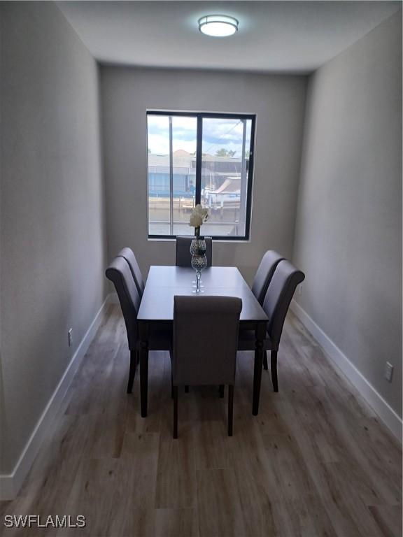 198 Gulfview Rd, Punta Gorda, FL 33950 - dining room with wood finished floors and baseboards