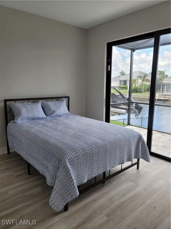 198 Gulfview Rd, Punta Gorda, FL 33950 - bedroom with access to outside and wood finished floors