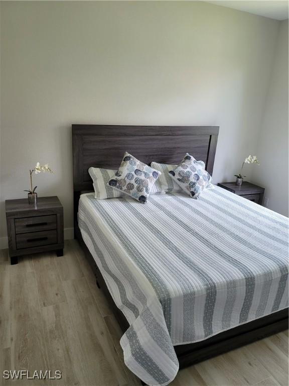 198 Gulfview Rd, Punta Gorda, FL 33950 - bedroom featuring light wood finished floors and baseboards