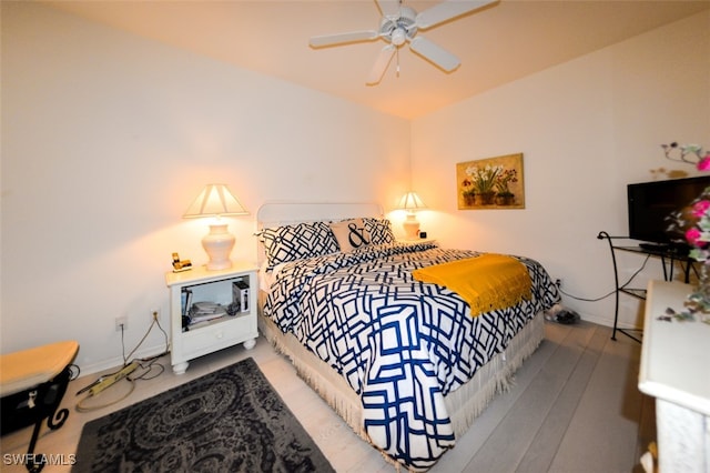 bedroom featuring ceiling fan and wood-type flooring