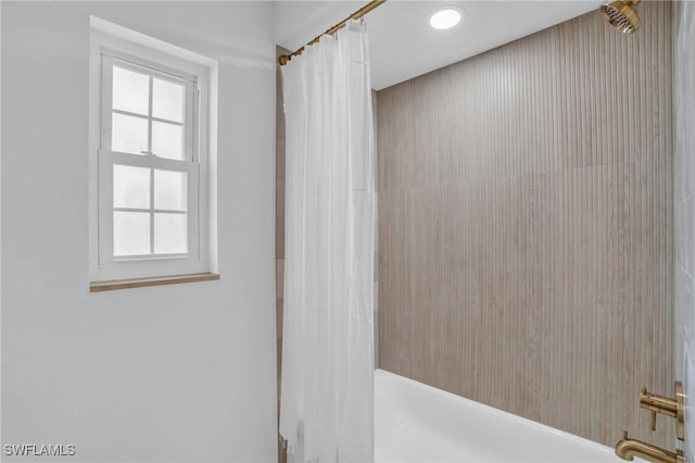 bathroom with shower / bath combination with curtain