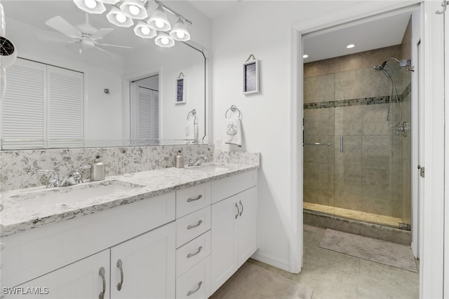 bathroom with vanity, tile patterned floors, a shower with shower door, and ceiling fan