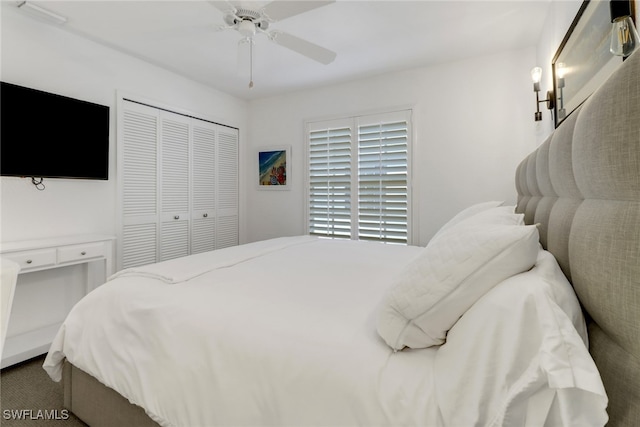 carpeted bedroom with a closet and ceiling fan