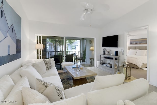 living room with light hardwood / wood-style floors and ceiling fan