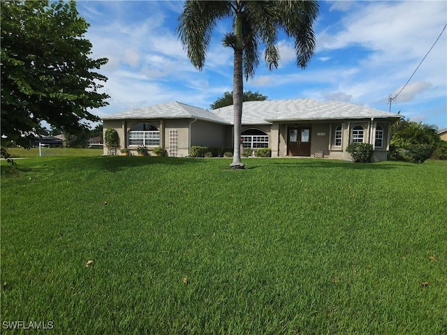 ranch-style house with stucco siding and a front yard