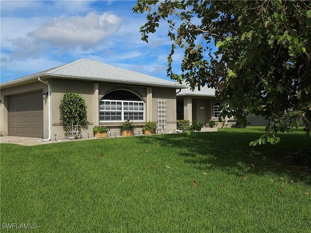 ranch-style house featuring an attached garage, a front lawn, and stucco siding