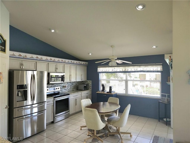 kitchen with stainless steel appliances, light countertops, backsplash, and light tile patterned floors