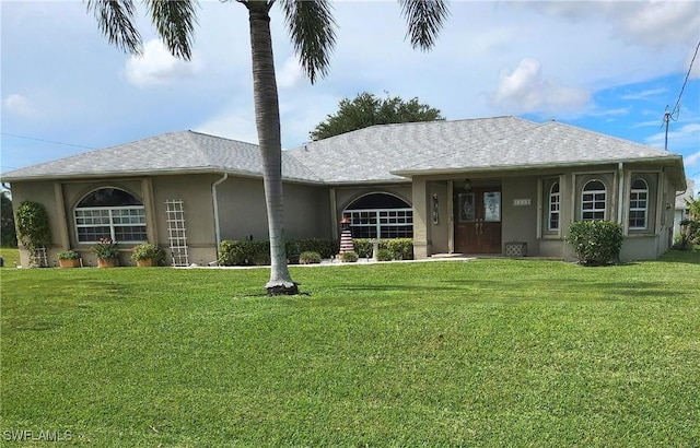 single story home featuring a front yard and stucco siding