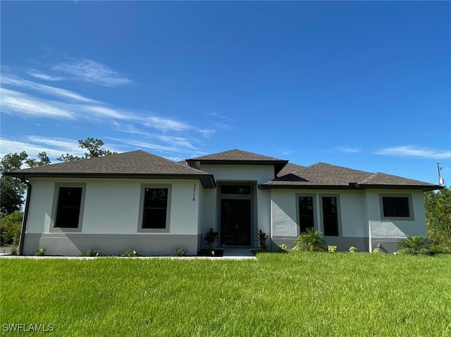 view of front of home with a front lawn