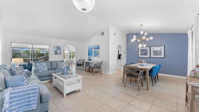 tiled living room featuring an inviting chandelier and lofted ceiling