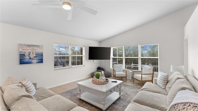 living room with ceiling fan, tile patterned flooring, and high vaulted ceiling