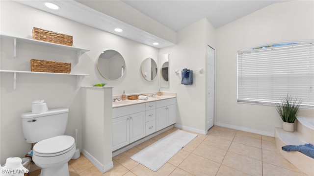 bathroom featuring tile patterned flooring, vanity, and toilet